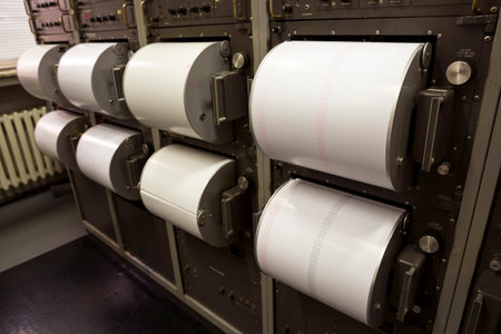 Seismograph records an earthquake on the sheet of measuring paper. Seismological device for...