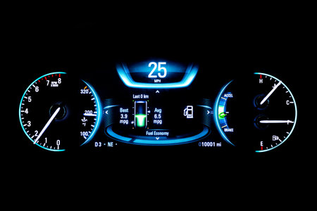Modern light car mileage (dashboard, milage) isolated on a black background. New display of a modern...