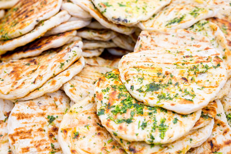 Doner kebab bread slices with garlic, oil and parsley.