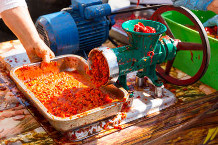 Ajvar (Ljutenica) is a pepper-based condiment made principally from red bell peppers. It may also contain tomato, garlic, eggplant and chili peppers.の写真素材