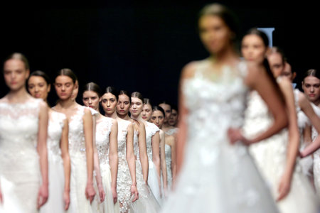 Sofia, Bulgaria - 23 March 2017: Female models walk the runway in beautiful stylish white wedding dresses during a Fashion Show. Fashion catwalk event showing new collection of clothes.のeditorial素材
