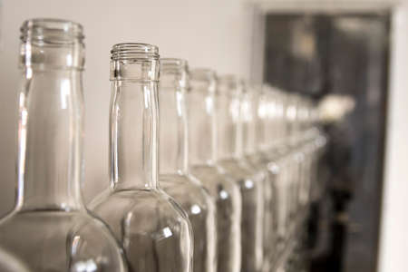 Whiskey whiskey and brandy distillery. Empty glass bottles.の写真素材