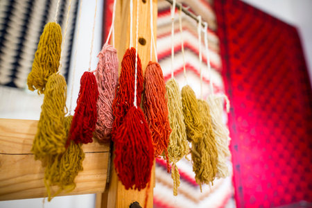 Weaving equipment for Chiprovtsi Carpets. Traditional colorful carpets from Chiprovtsi region in Bulgaria. Hand-woven (hand-made) carpets with different elements and colours. Ethnic and folk patterns.の写真素材