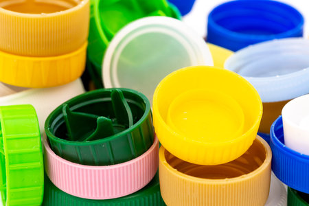 Colorful plastic bottle caps. Studio shot. Plastic waste.