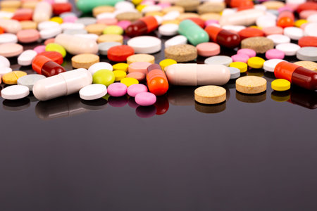 Different colorful pills and capsules. Global pharmaceutical industry for billions dollars per year....