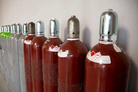 Seamless Steel Industrial Gas Cylinders. Pressurized Cylinder. Industrial stainless steel bottles in line.の写真素材