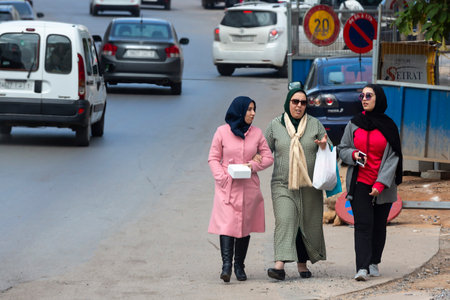 Rabat, Morocco - 30 November 2018: Three Moroccan women with hidjabs walk in the center of Rabat.のeditorial素材