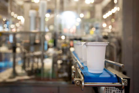 Yoghurt packing machine is shown at a food and drink exhibition.の写真素材