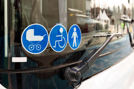 New modern bus on LPG. International Symbol of Access - Wheelchair Symbol (handicapped, physically challenged and disabled), Baby Stroller Symbol and Elderly (Old) People Symbol on the windshield.の写真素材