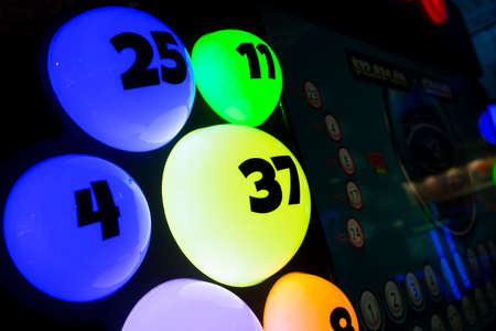 Colourful illuminated bingo balls. Gambling machine and euqipment.の写真素材