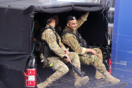 Beirut, Lebanon - 9 April, 2019: Armed Lebanese soldiers travel in an army truck on a street of...