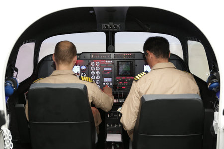 Fighter aircraft simulator training room with two pilots. A flight simulator is a device that...