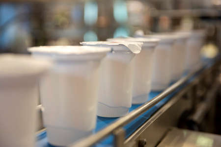 Yoghurt packing machine is shown at a food and drink exhibition.の写真素材