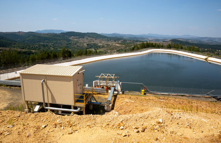 Gold mine water processing pool equipment is seen from the outside.