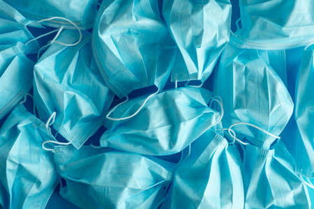Used blue surgical protective masks. Coronavirus (COVID-19) hysteria is leading to mass mask shortages in the beginning of 2020.の写真素材