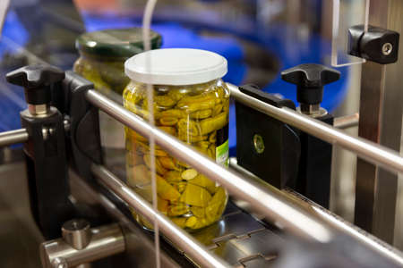 Green beans in a jar on a production line in a factoryの写真素材