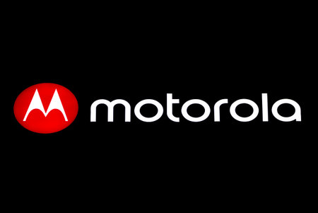 Sofia, Bulgaria - 13 August, 2020: Motorola red logo and white brand name is seen isolated on a black backgroundのeditorial素材