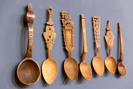 Different carved wooden spoons are seen arranged.の写真素材
