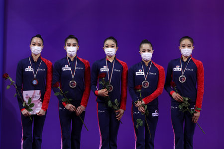 Sofia, Bulgaria - 27 March, 2021: Members of team Japan pose with their silver medals on the podium at Group Apparatus Finals Award Ceremony at the 2021 Rhythmic Gymnastics "Sofia World Cup".のeditorial素材