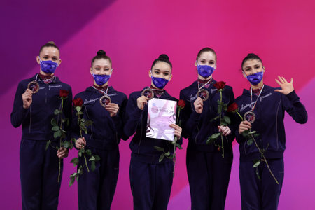 Sofia, Bulgaria - 27 March, 2021: Members of team Azerbaijan pose with their bronze medals on the podium at Group Apparatus Finals Award Ceremony at the 2021 Rhythmic Gymnastics "Sofia World Cup".のeditorial素材