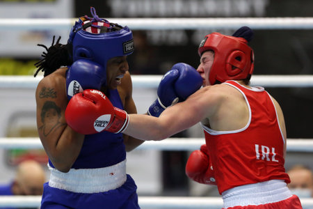 Sofia, Bulgaria - 26 February, 2021: Aoife O'Rourke (red) of Ireland and Naomi Graham of USA fight in their semifinal round of Middle (W75kg) category of the 72-nd International Boxing Tournament "Strandja" 2021.のeditorial素材
