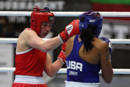 Sofia, Bulgaria - 26 February, 2021: Aoife O'Rourke (red) of Ireland and Naomi Graham of USA fight in their semifinal round of Middle (W75kg) category of the 72-nd International Boxing Tournament "Strandja" 2021.のeditorial素材