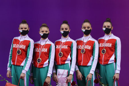 Sofia, Bulgaria - 27 March, 2021: Members of team Bulgaria pose with their gold medals on the podium at Group Award Ceremony for All-Around at the 2021 Rhythmic Gymnastics "Sofia World Cup".のeditorial素材