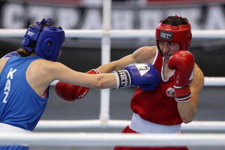 Sofia, Bulgaria. 27th February, 2021. Stoyka Krasteva (red) of Bulgaria and Angelina Lukas of Kazakhstan fight in their final round of Fly (W51kg) category of the 72-nd International Boxing Tournament "Strandja" 2021.のeditorial素材