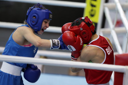 Sofia, Bulgaria. 27th February, 2021. Stoyka Krasteva (red) of Bulgaria and Angelina Lukas of Kazakhstan fight in their final round of Fly (W51kg) category of the 72-nd International Boxing Tournament "Strandja" 2021.のeditorial素材