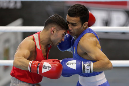 Sofia, Bulgaria. 27th February, 2021. Daniel Asenov (red) of Bulgaria and Deepak Komar of India fight in their final round of Fly (52kg) category of the 72-nd International Boxing Tournament "Strandja" 2021.のeditorial素材