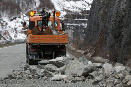 Sofia, Bulgaria - 31 January, 2021: Workers clean the aftermath of a stone landslide at the eighth kilometer of Struma Motorway.のeditorial素材