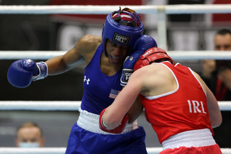 Sofia, Bulgaria - 26 February, 2021: Aoife O'Rourke (red) of Ireland and Naomi Graham of USA fight in their semifinal round of Middle (W75kg) category of the 72-nd International Boxing Tournament "Strandja" 2021.のeditorial素材