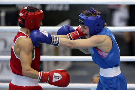 Sofia, Bulgaria. 27th February, 2021. Stoyka Krasteva (red) of Bulgaria and Angelina Lukas of Kazakhstan fight in their final round of Fly (W51kg) category of the 72-nd International Boxing Tournament "Strandja" 2021.のeditorial素材