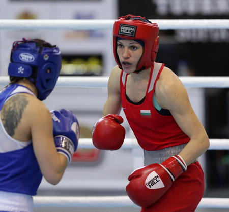 Sofia, Bulgaria. 27th February, 2021. Stanimira Petrova (red) of Bulgaria and Karina Tazabekova of Russia fight in their final round of Light (W57kg) category of the 72-nd International Boxing Tournament "Strandja" 2021.のeditorial素材