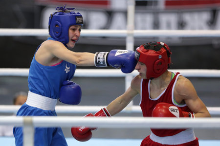 Sofia, Bulgaria. 27th February, 2021. Stoyka Krasteva (red) of Bulgaria and Angelina Lukas of Kazakhstan fight in their final round of Fly (W51kg) category of the 72-nd International Boxing Tournament "Strandja" 2021.のeditorial素材