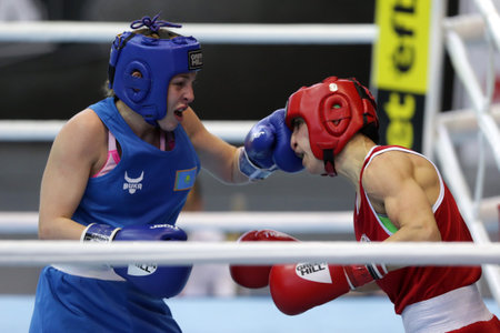 Sofia, Bulgaria. 27th February, 2021. Stoyka Krasteva (red) of Bulgaria and Angelina Lukas of Kazakhstan fight in their final round of Fly (W51kg) category of the 72-nd International Boxing Tournament "Strandja" 2021.のeditorial素材