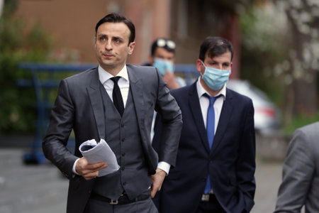 Sofia, Bulgaria: 27 April, 2021: Bulgarian former professional footballer Dimitar Berbatov (L) leaves a press conference at which he announced that he would run for president of the Bulgarian Football Union.のeditorial素材