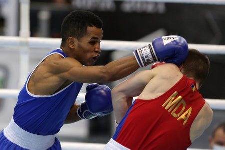Sofia, Bulgaria. 27th February, 2021. Dorin Bucsa (red) of Moldova and Havier Ibanes of Bulgaria fight in their final round of Feather (57kg) category of the 72-nd International Boxing T ournament "Strandja" 2021.のeditorial素材
