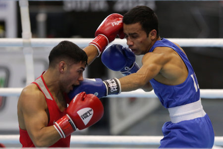 Sofia, Bulgaria. 27th February, 2021. Daniel Asenov (red) of Bulgaria and Deepak Komar of India fight in their final round of Fly (52kg) category of the 72-nd International Boxing Tournament "Strandja" 2021.のeditorial素材