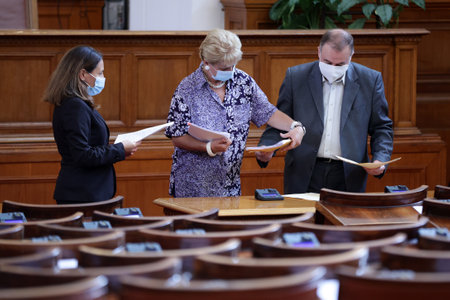 Sofia, Bulgaria - 29 July, 2021: Quaestors hold folders in the parliament plenary hall of The National Assembly of the Republic of Bulgaria before a session.のeditorial素材