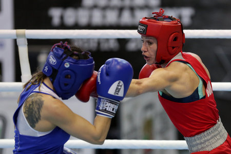 Sofia, Bulgaria. 27th February, 2021. Stanimira Petrova (red) of Bulgaria and Karina Tazabekova of Russia fight in their final round of Light (W57kg) category of the 72-nd International Boxing Tournament "Strandja" 2021.のeditorial素材