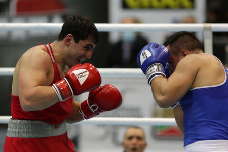 Sofia, Bulgaria. 27th February, 2021. Narek Manasyan (red) of Armenia and Radoslav Pantaleev of Bulgaria fight in their final round of Heavy (91kg) category of the 72-nd International Boxing Tournament "Strandja" 2021.のeditorial素材
