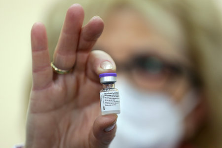 Sofia, Bulgaria - 18 January, 2021: A vial of the Pfizer-BioNTech vaccine against COVID-19 is shown by a medical staff member at Aleksandrovska University Hospital.のeditorial素材