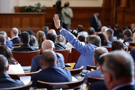 Sofia, Bulgaria - 29 July, 2021: Deputy rises his hand in the parliament plenary hall of The National Assembly of the Republic of Bulgaria during a session.のeditorial素材