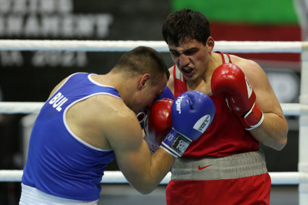 Sofia, Bulgaria. 27th February, 2021. Narek Manasyan (red) of Armenia and Radoslav Pantaleev of Bulgaria fight in their final round of Heavy (91kg) category of the 72-nd International Boxing Tournament "Strandja" 2021.のeditorial素材