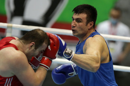 Sofia, Bulgaria. 27th February, 2021.Tsotne Rogava (red) of Ukraine and Bakhodir Jalolov of Uzbekistan fight in their final round of Super Heavy (+91kg) category of the 72-nd International Boxing Tournament "Strandja" 2021.のeditorial素材