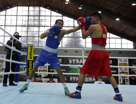 Sofia, Bulgaria. 27th February, 2021. Daniel Asenov (red) of Bulgaria and Deepak Komar of India fight in their final round of Fly (52kg) category of the 72-nd International Boxing Tournament "Strandja" 2021.のeditorial素材