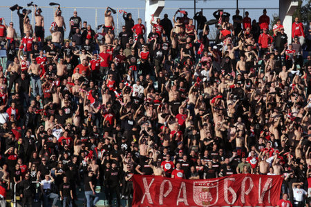 Sofia, Bulgaria: 25 April, 2021: CSKA Sofia's supporters cheer their team during the national championship football match between Levski and CSKA Sofia. Football fans have been allowed to attend the stadium with less than 30% of the seats amidst the coronのeditorial素材