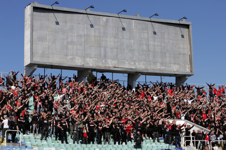 Sofia, Bulgaria: 25 April, 2021: CSKA Sofia's supporters cheer their team during the national championship football match between Levski and CSKA Sofia. Football fans have been allowed to attend the stadium with less than 30% of the seats amidst the coronのeditorial素材