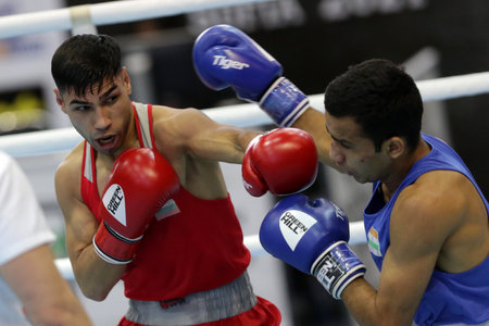 Sofia, Bulgaria. 27th February, 2021. Daniel Asenov (red) of Bulgaria and Deepak Komar of India fight in their final round of Fly (52kg) category of the 72-nd International Boxing Tournament "Strandja" 2021.のeditorial素材